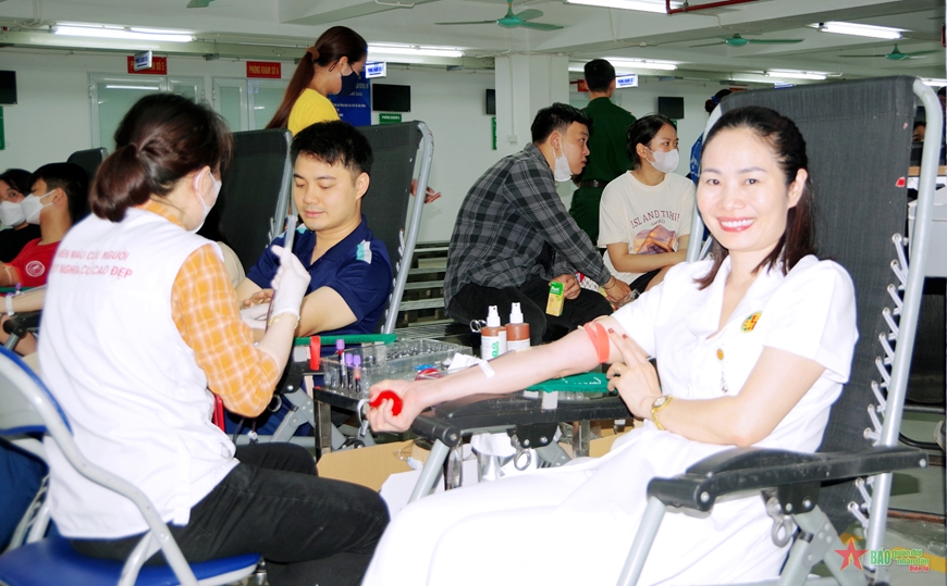 A blood donation event with people donating blood.2