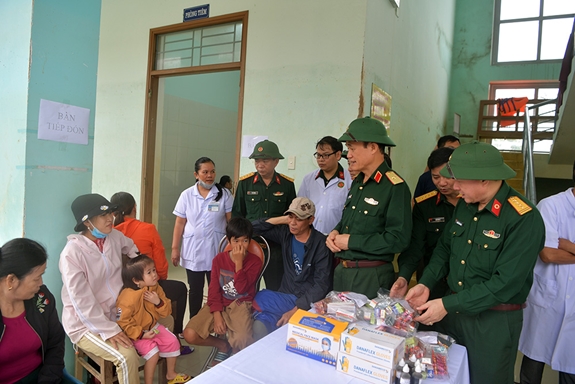 A blood donation event with people donating blood.2