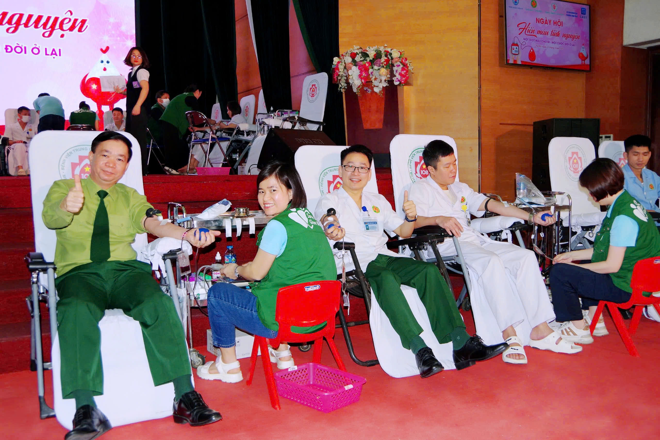 A blood donation event with people donating blood.2