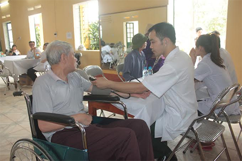 A blood donation event with people donating blood.2