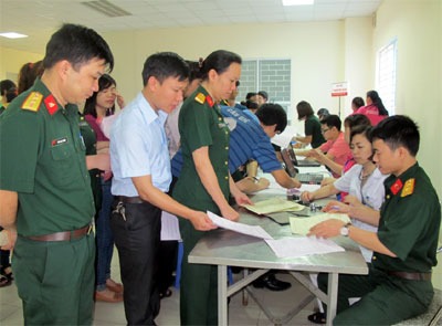 A blood donation event with people donating blood.2